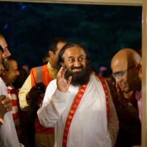 Gurudev Sri Sri Ravi Shankar smiling at a devotee at The Art of Living International Center