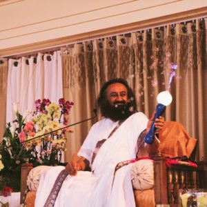 Gurudev Sri Sri Ravi Shankar holding a magic wand